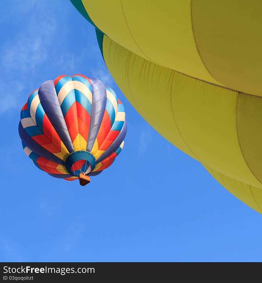 Colorful hot air balloon over blue sky