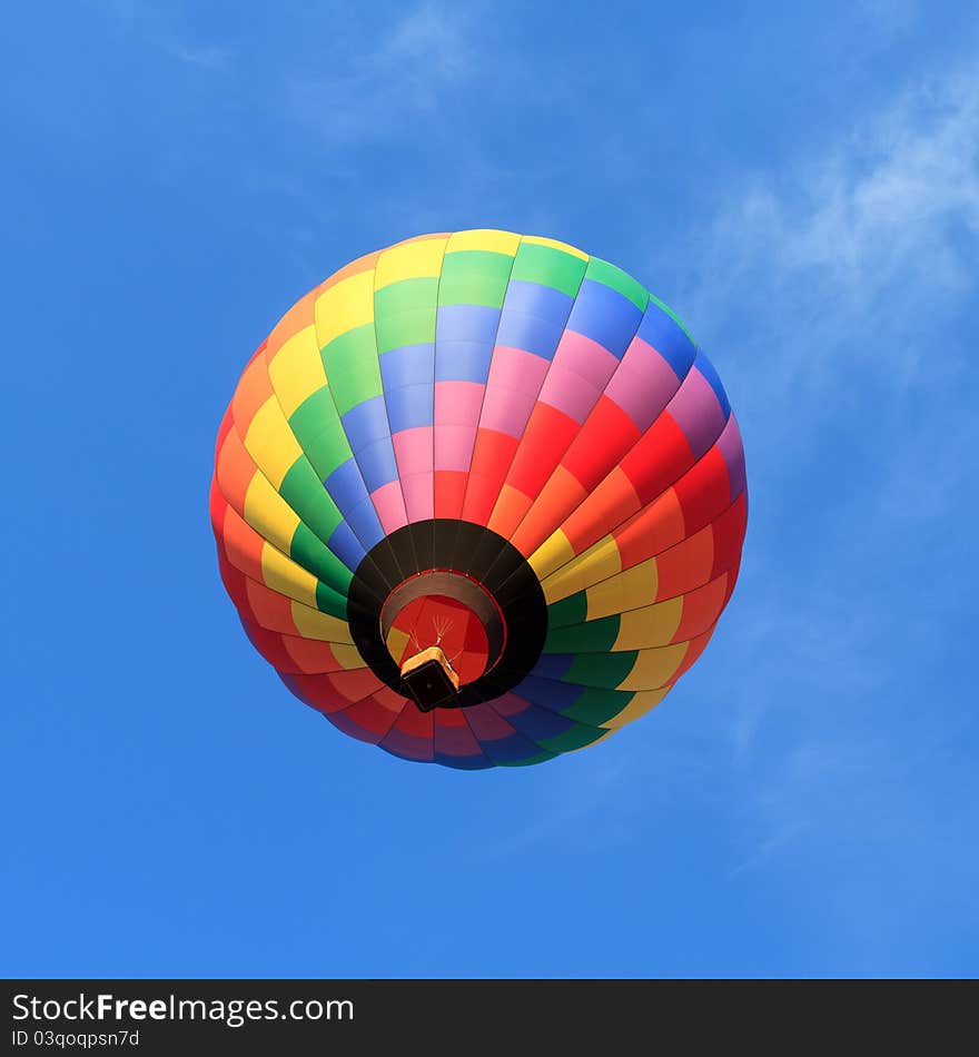 Colorful hot air balloon over blue sky