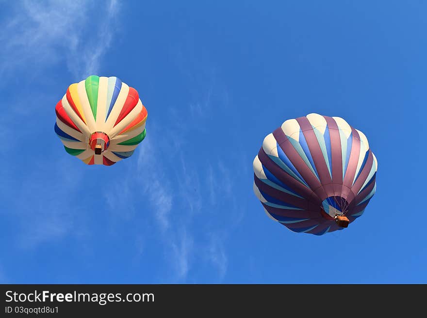 Hot air balloons over blue sky