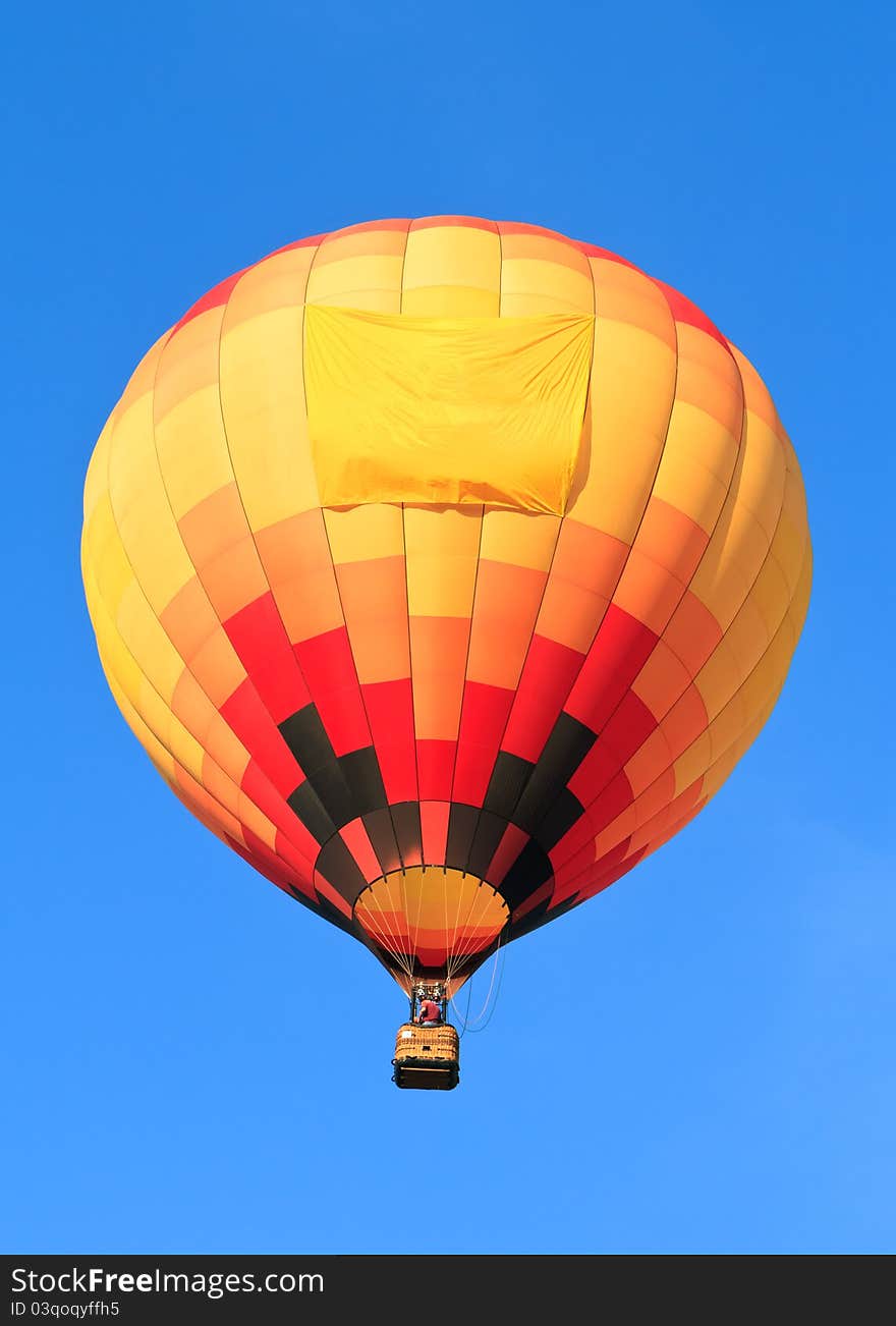 Colorful hot air balloon with empty banner