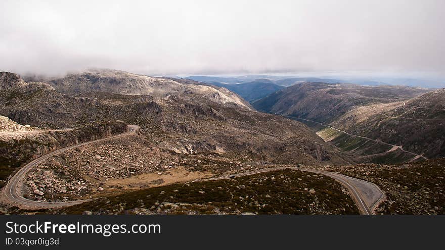 Panoramic view of mountain road and hills