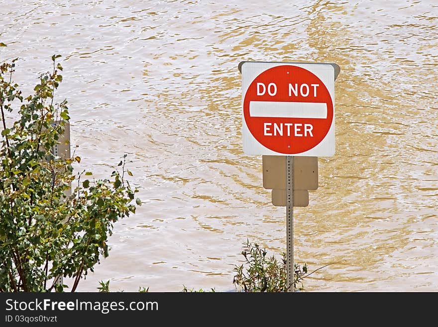 The river floods a parking lot after a hurricane. The river floods a parking lot after a hurricane.