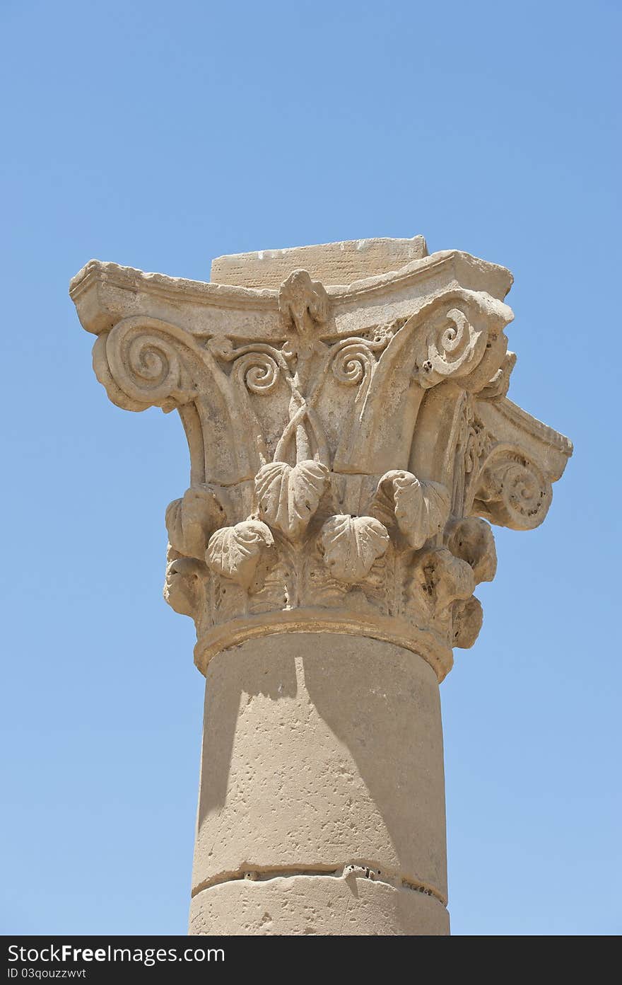 Carvings at the top of an ancient roman column at an egyptian temple