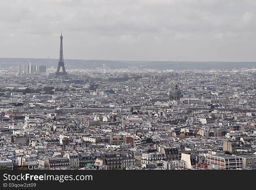 Eiffel Tower from across Parisan rooftops. Eiffel Tower from across Parisan rooftops.