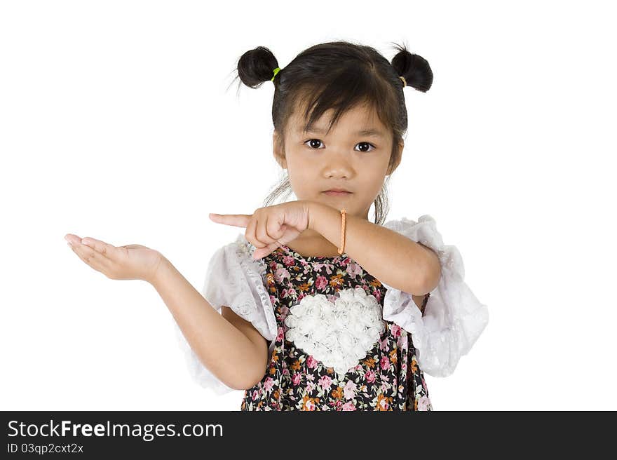 Cute Asian girl pointing at something in her hand, isolated on white background. Cute Asian girl pointing at something in her hand, isolated on white background