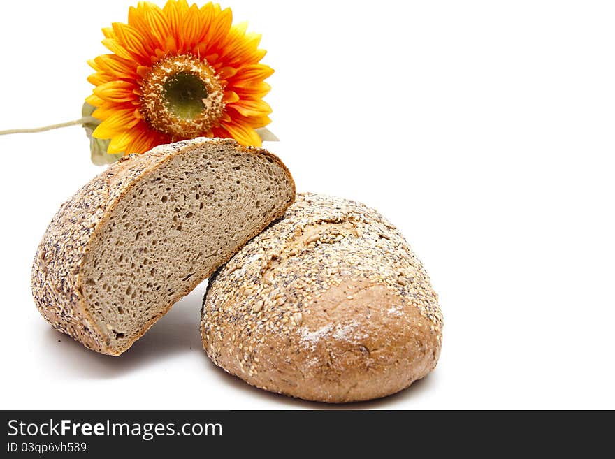 More grain bread with sunflower on white background