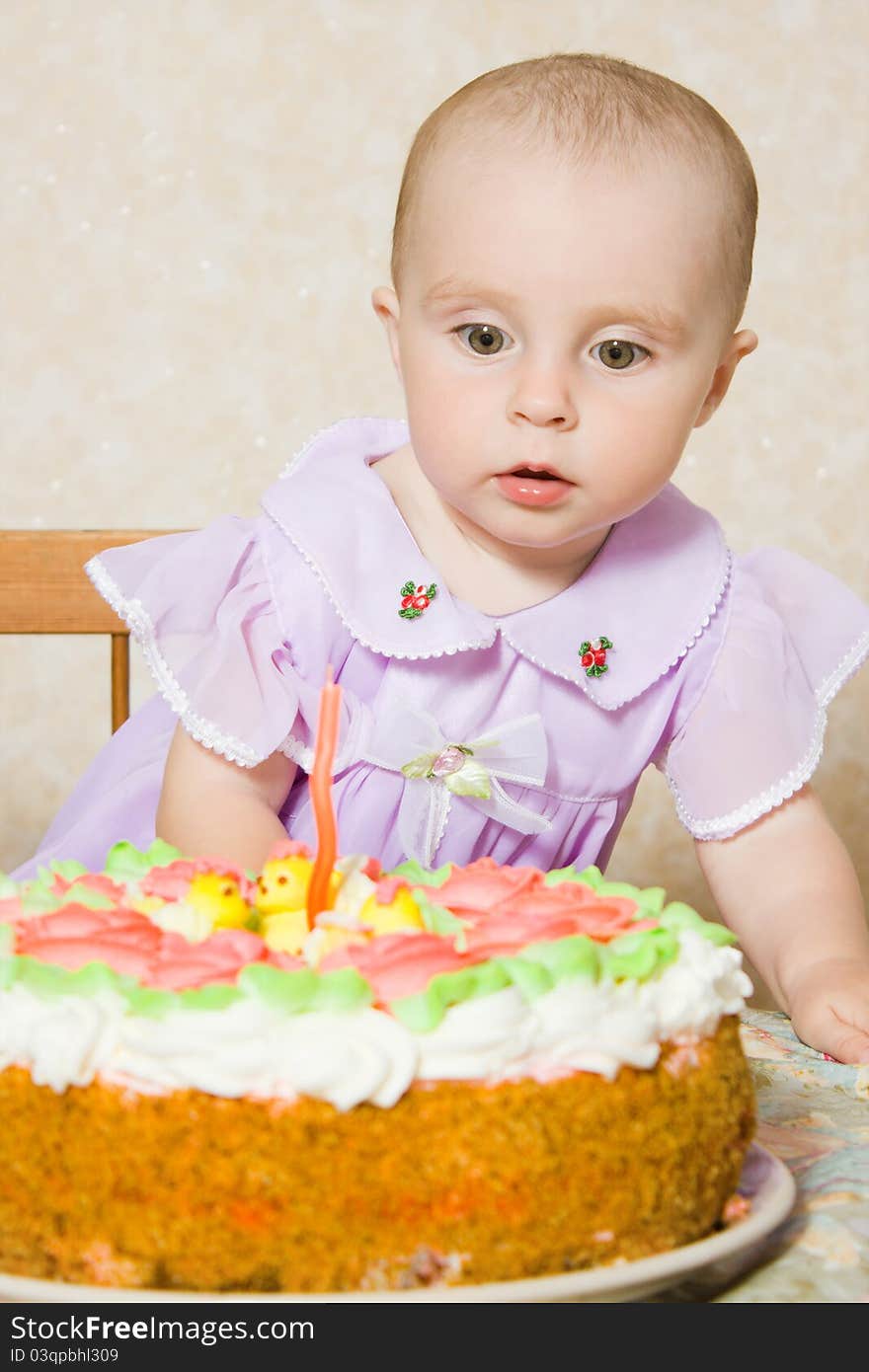 Baby with the birthday cake on a white background. Baby with the birthday cake on a white background.