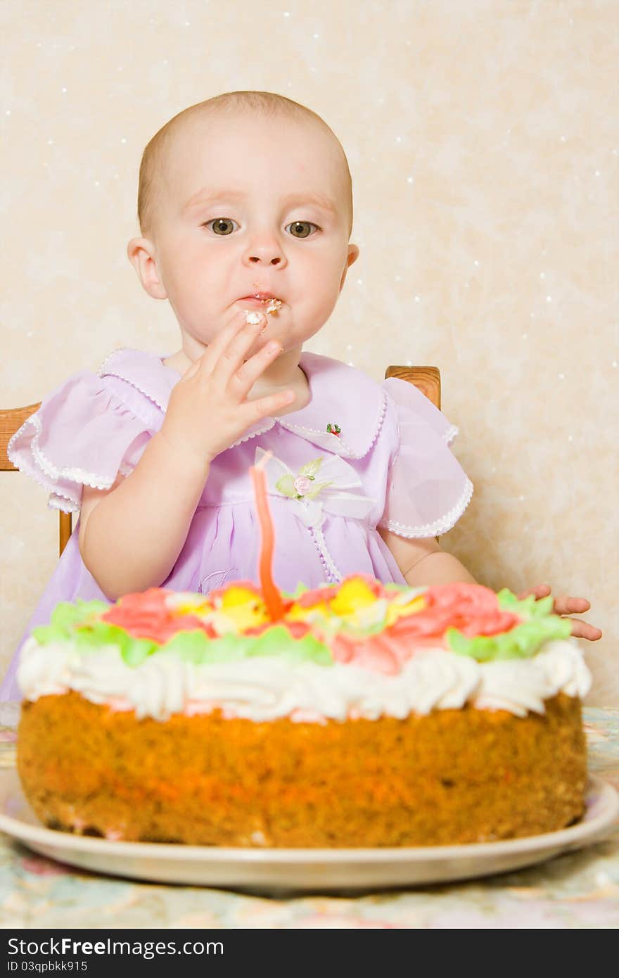 Baby with the birthday cake on a white background. Baby with the birthday cake on a white background.