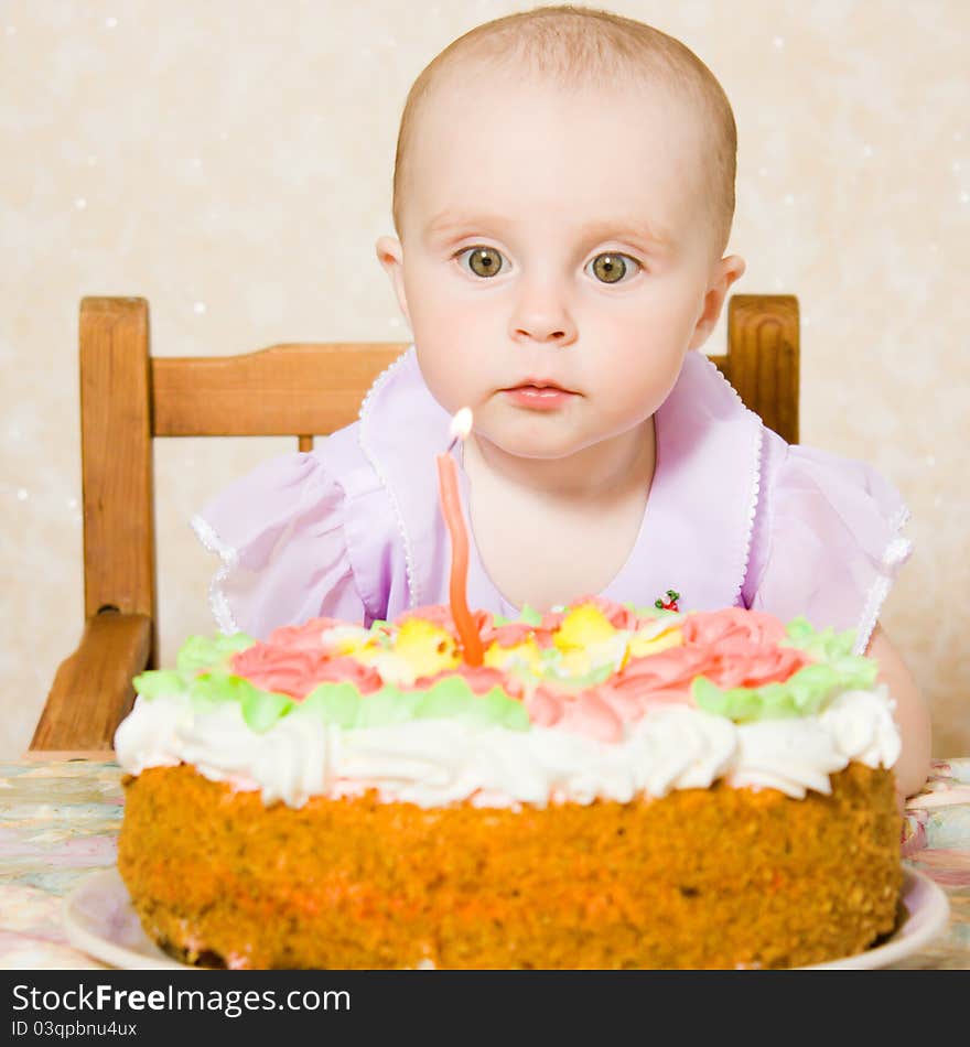 Baby with the birthday cake on a white background. Baby with the birthday cake on a white background.