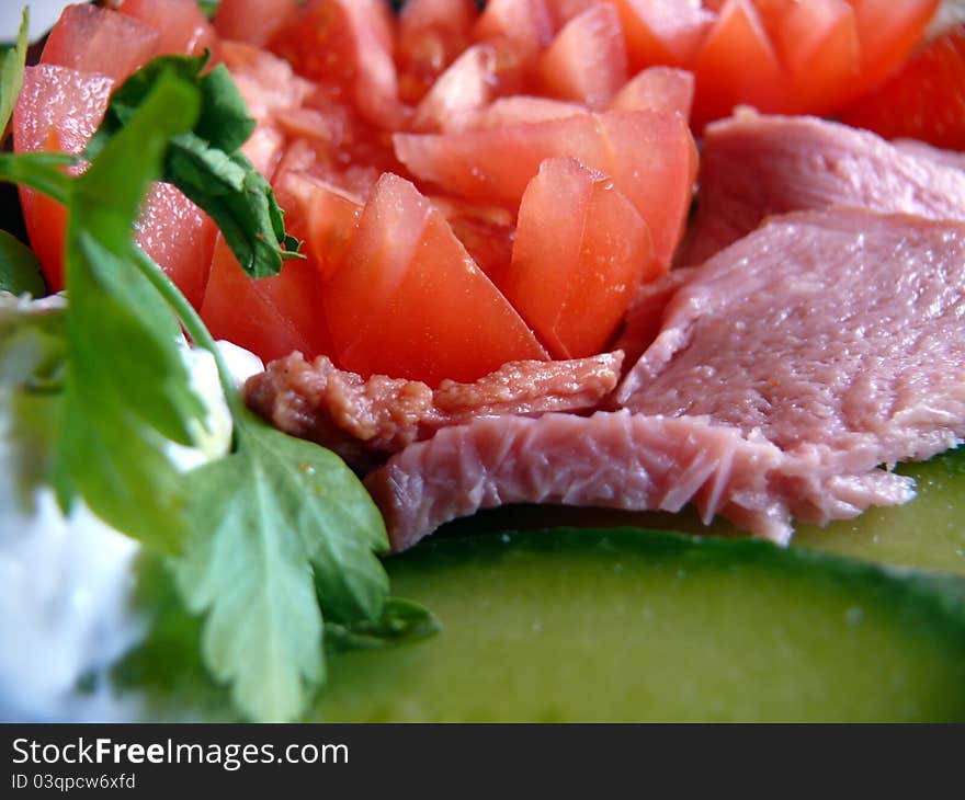 Fresh salad with tomatoes, cucumbers and ham