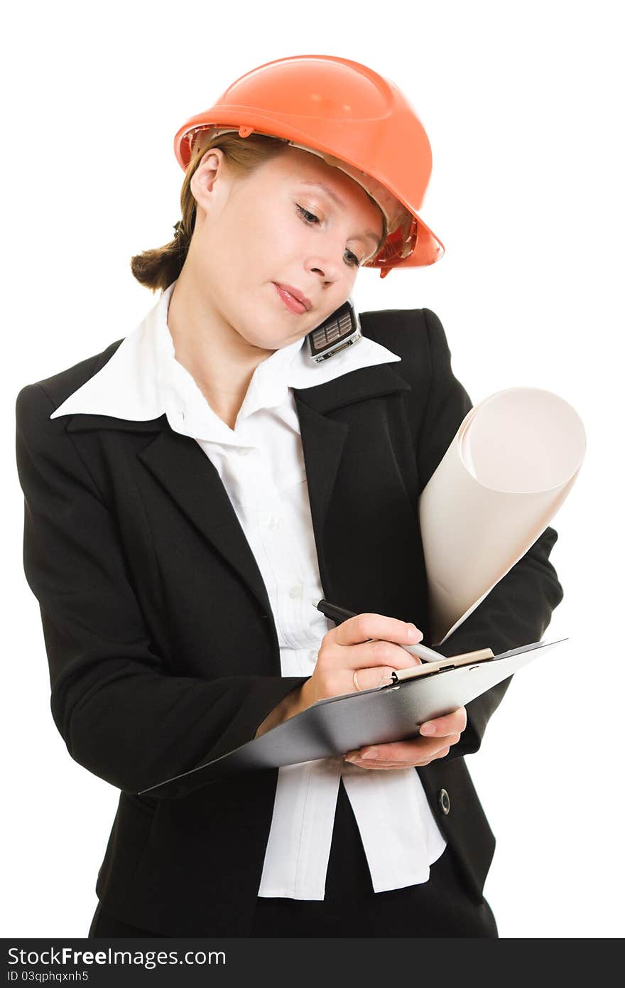 Businesswoman in a helmet with a mobile phone