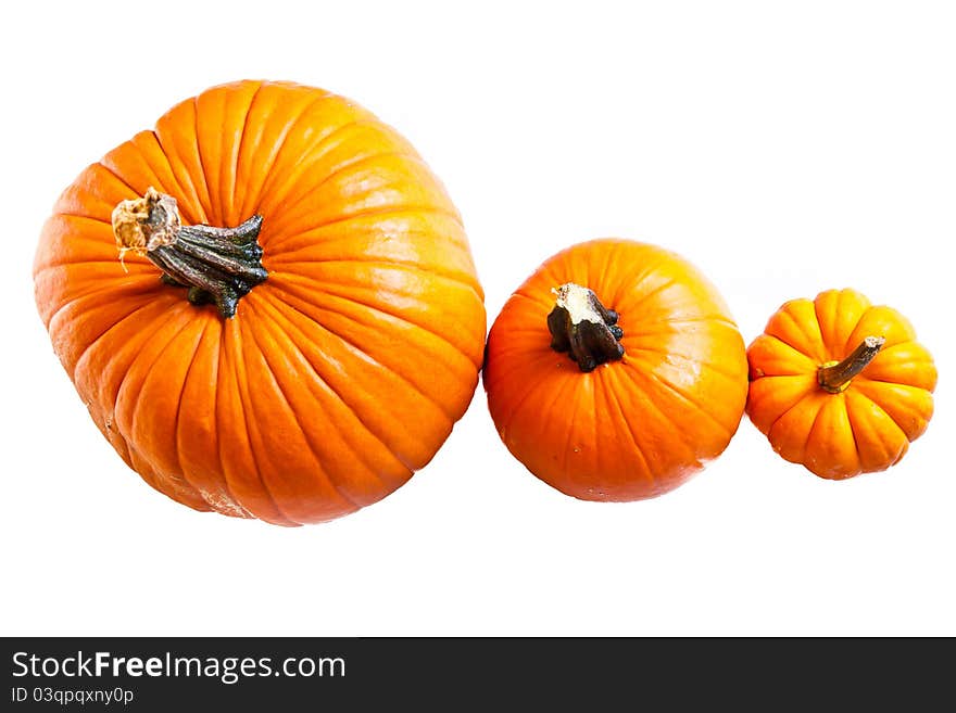 Ripe pumpkin fruits isolated on white