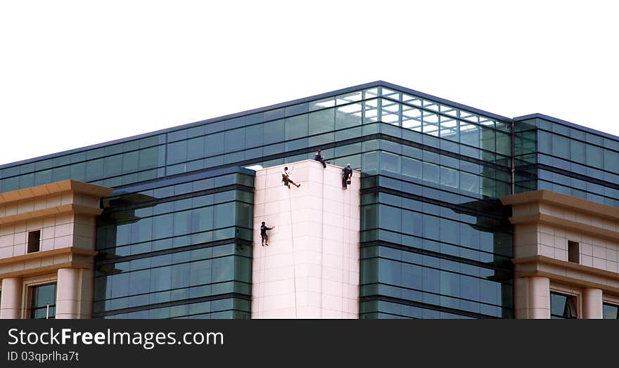 Window washers on tall new  building.