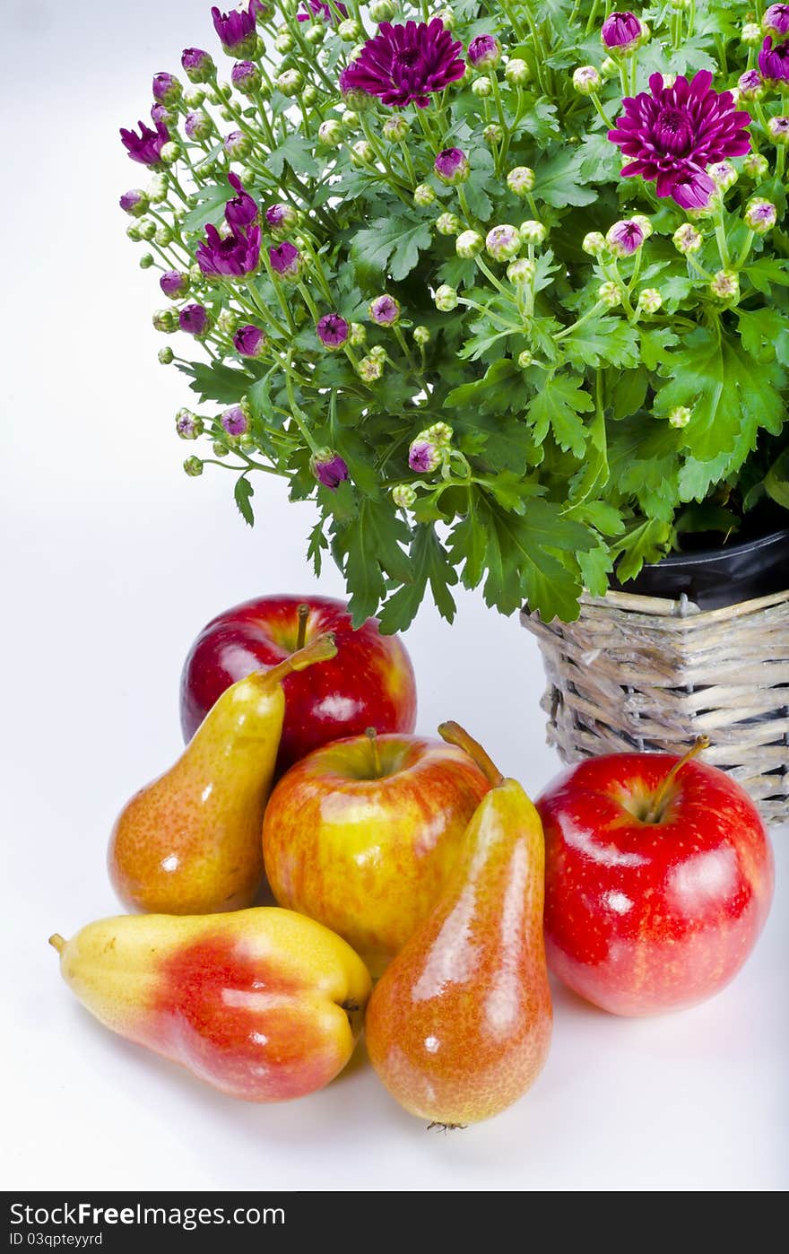 Basket with flowers and fresh fruits. Basket with flowers and fresh fruits