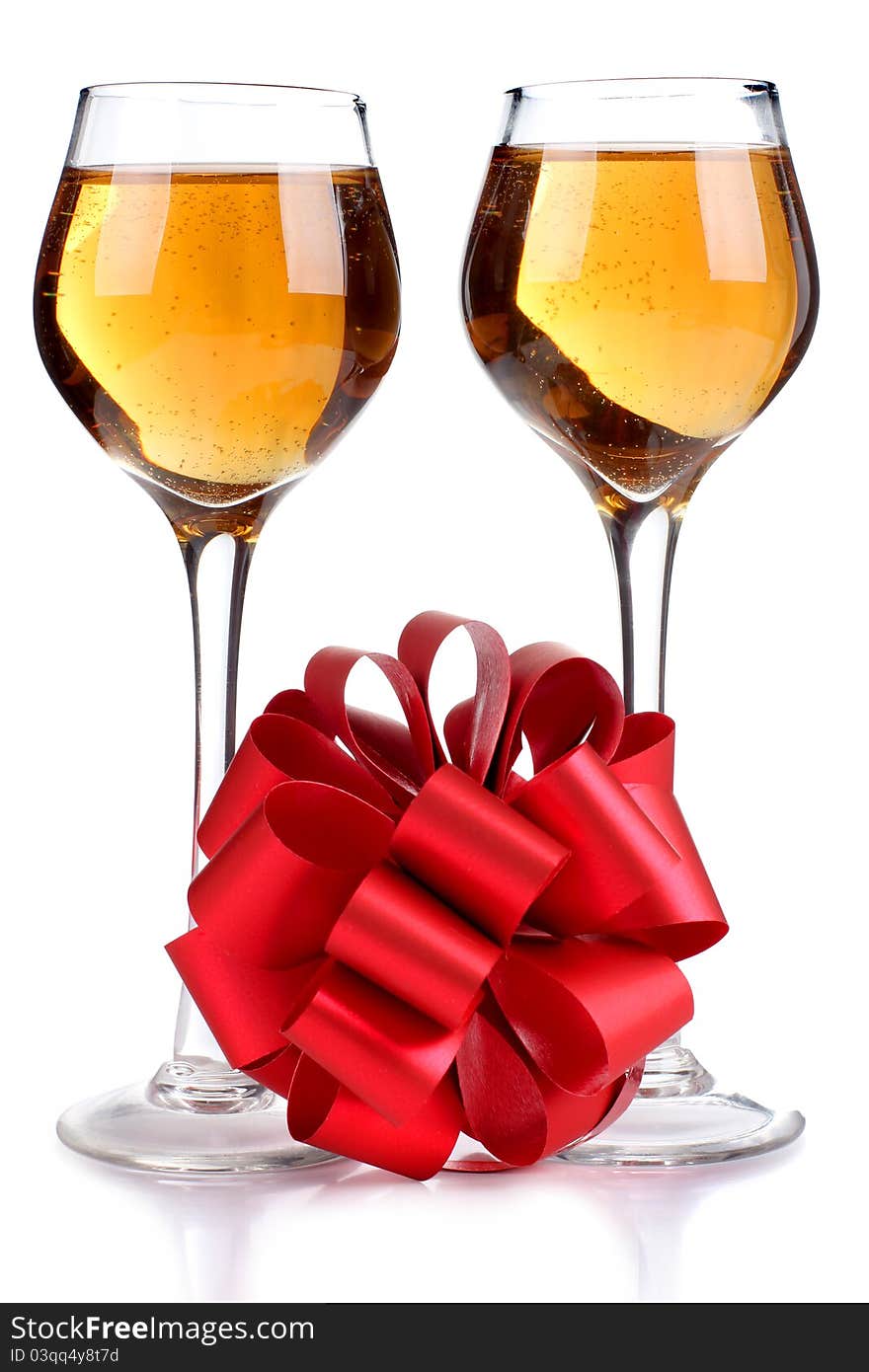 Color photo of wine glasses and a red ribbon. Color photo of wine glasses and a red ribbon