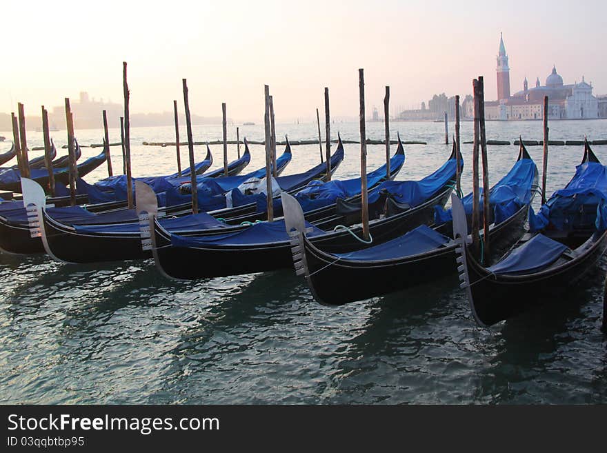 The gondola is a traditional, flat-bottomed Venetian rowing boat, well suited to the conditions of the Venetian Lagoon. For centuries gondolas were the chief means of transportation and most common watercraft within Venice. In modern times the iconic boats still have a role in public transport in the city, serving as traghetti (ferries) over the Grand Canal. Gondolas are hand made using 8 different types of wood (fir, oak, cherry, walnut, elm, mahogany, larch and lime) and are composed of 280 pieces. The gondola is a traditional, flat-bottomed Venetian rowing boat, well suited to the conditions of the Venetian Lagoon. For centuries gondolas were the chief means of transportation and most common watercraft within Venice. In modern times the iconic boats still have a role in public transport in the city, serving as traghetti (ferries) over the Grand Canal. Gondolas are hand made using 8 different types of wood (fir, oak, cherry, walnut, elm, mahogany, larch and lime) and are composed of 280 pieces