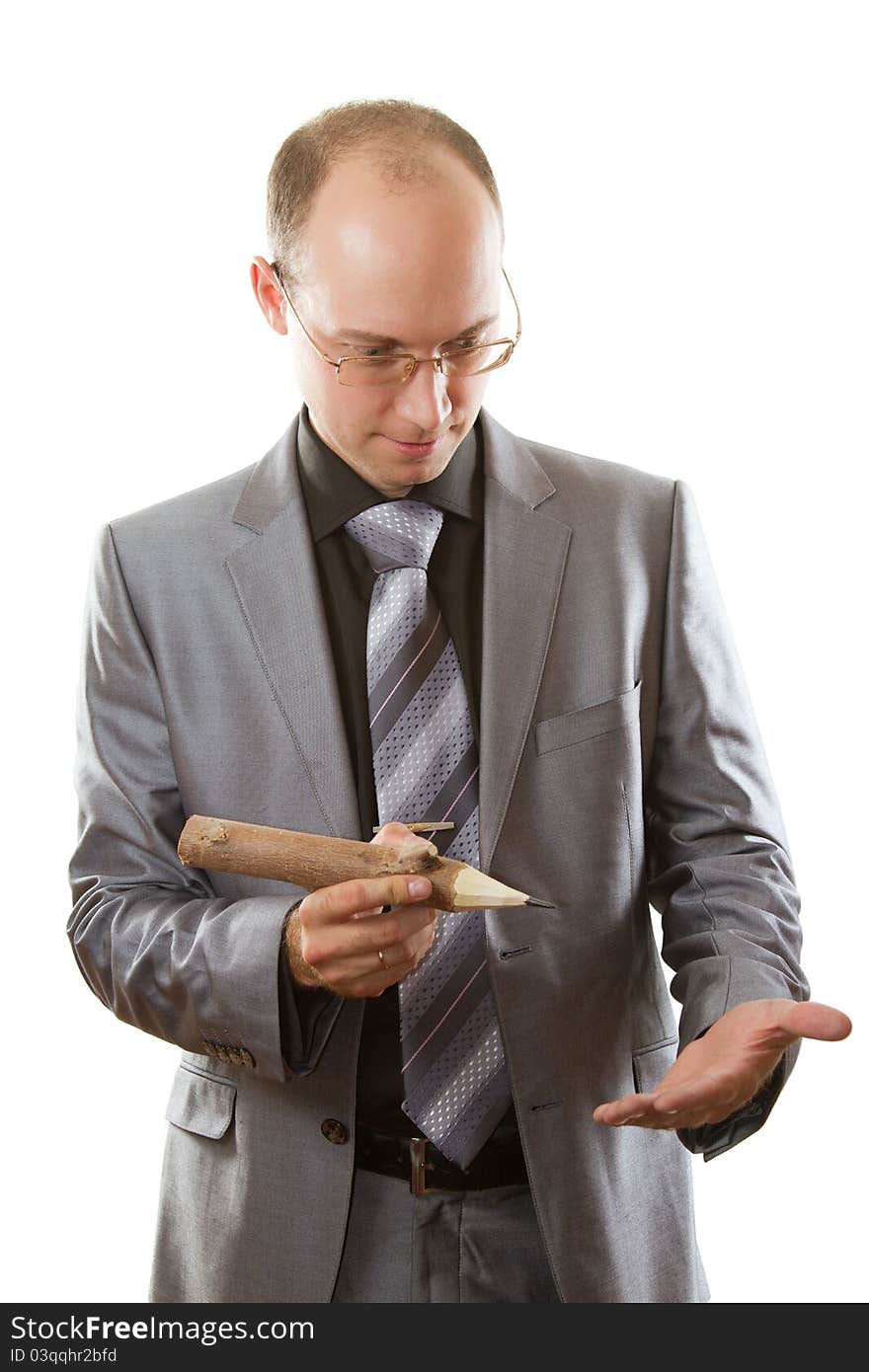 Businessman in a suit with a wooden pencil on a white background. Businessman in a suit with a wooden pencil on a white background