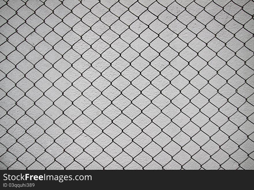 Iron net and white cement wall use for texture and background