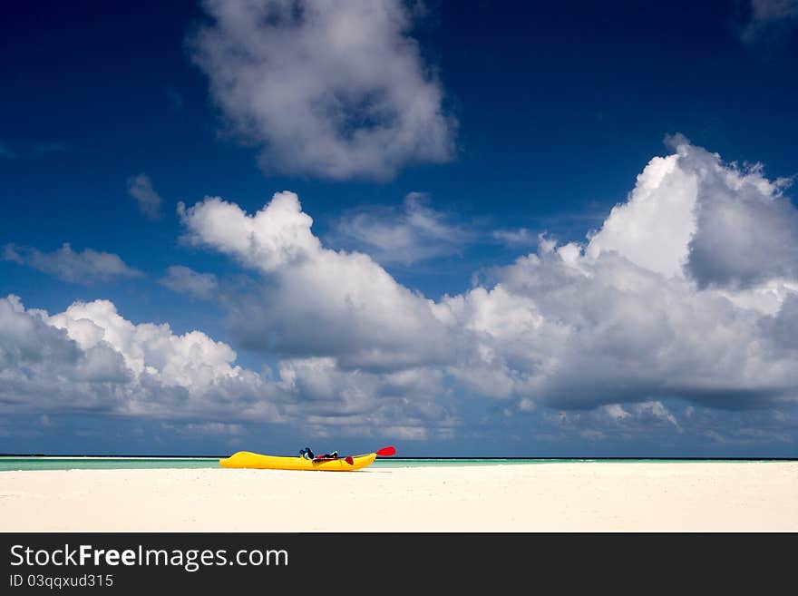 A Boat On The Sandy Beach Of  Maldives