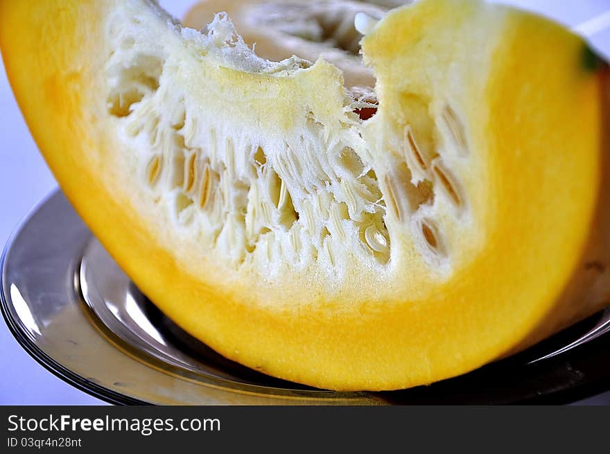 Slice of yellow pumpkin on a plate