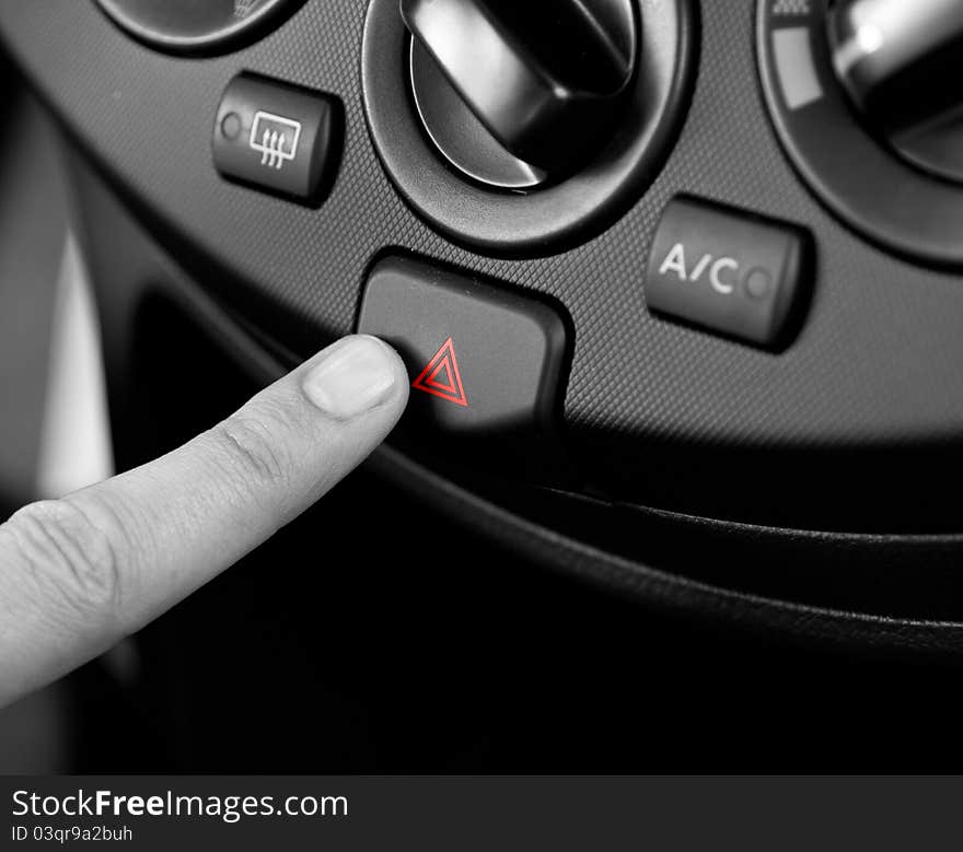 Emergency button being pushed (shallow DOF)