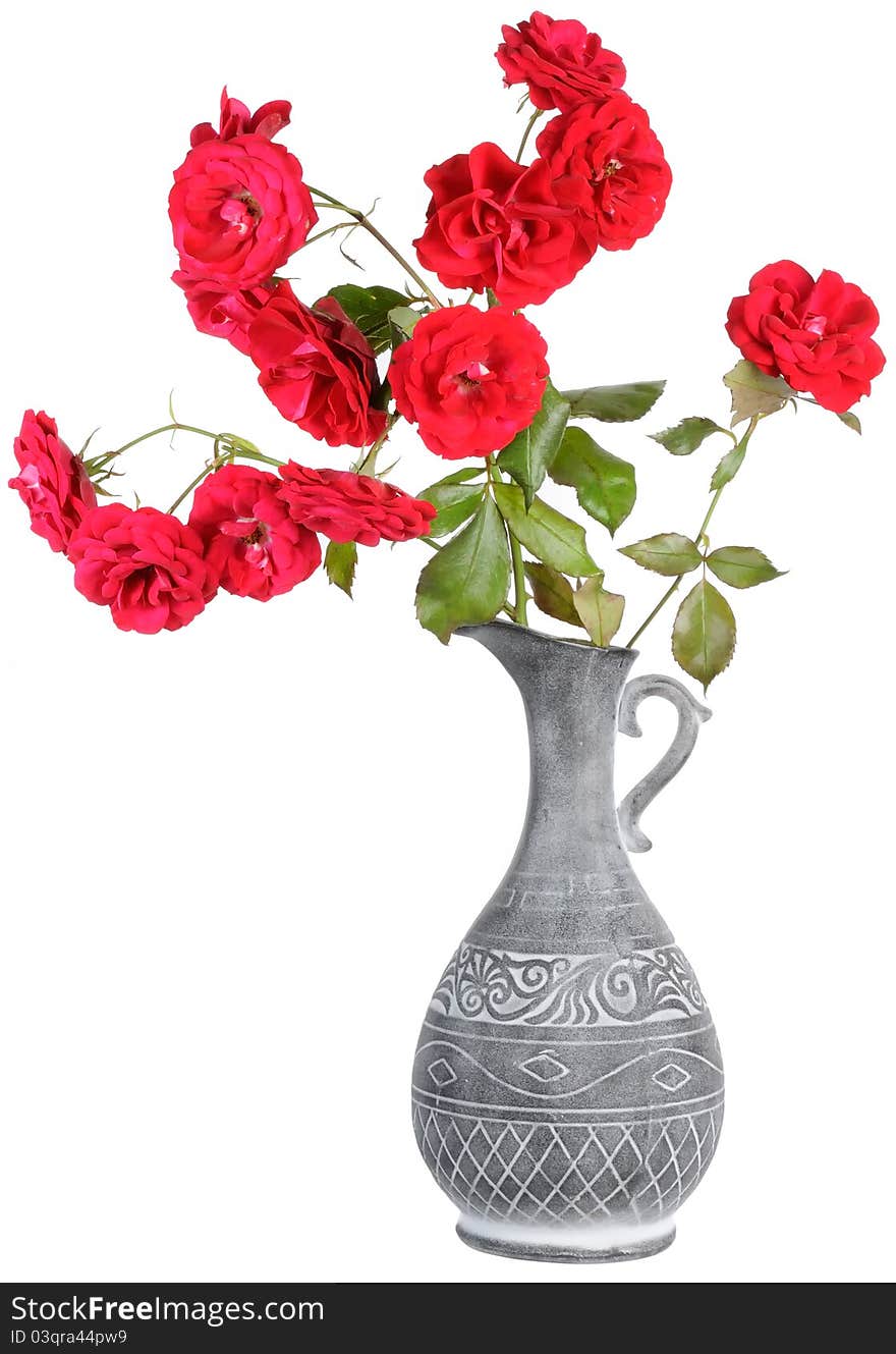 Red roses in a jar isolated on a white background. Red roses in a jar isolated on a white background