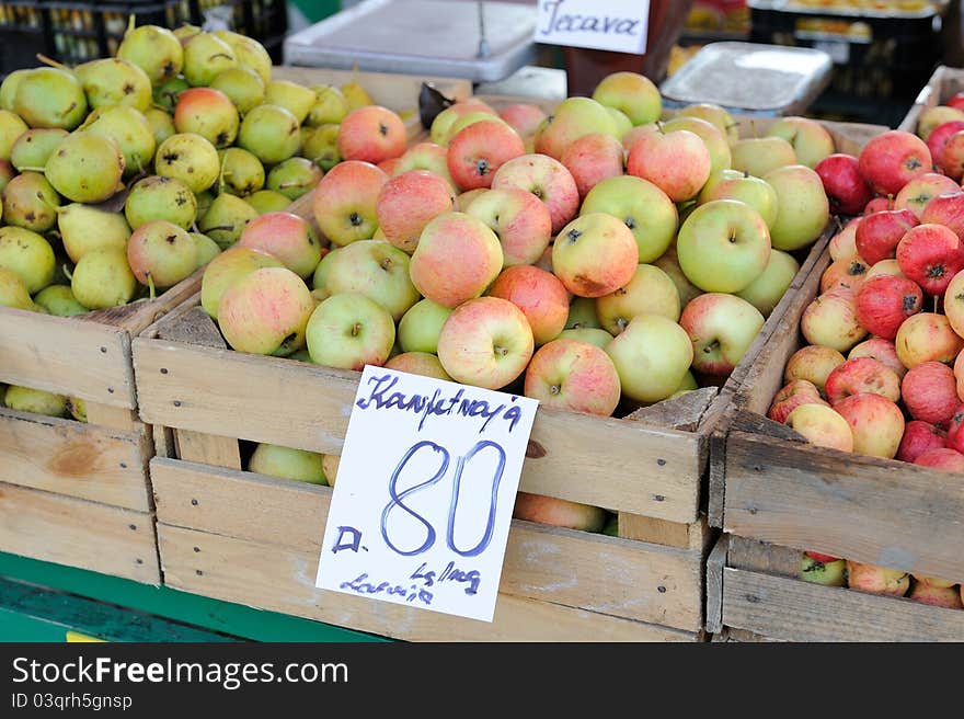 Ripe apples in box on a farm market. Ripe apples in box on a farm market