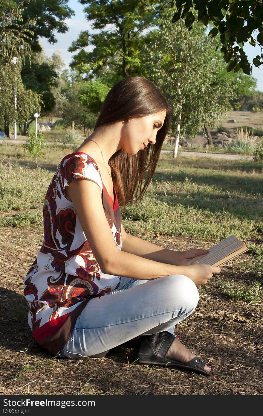 Adult girl reading a book