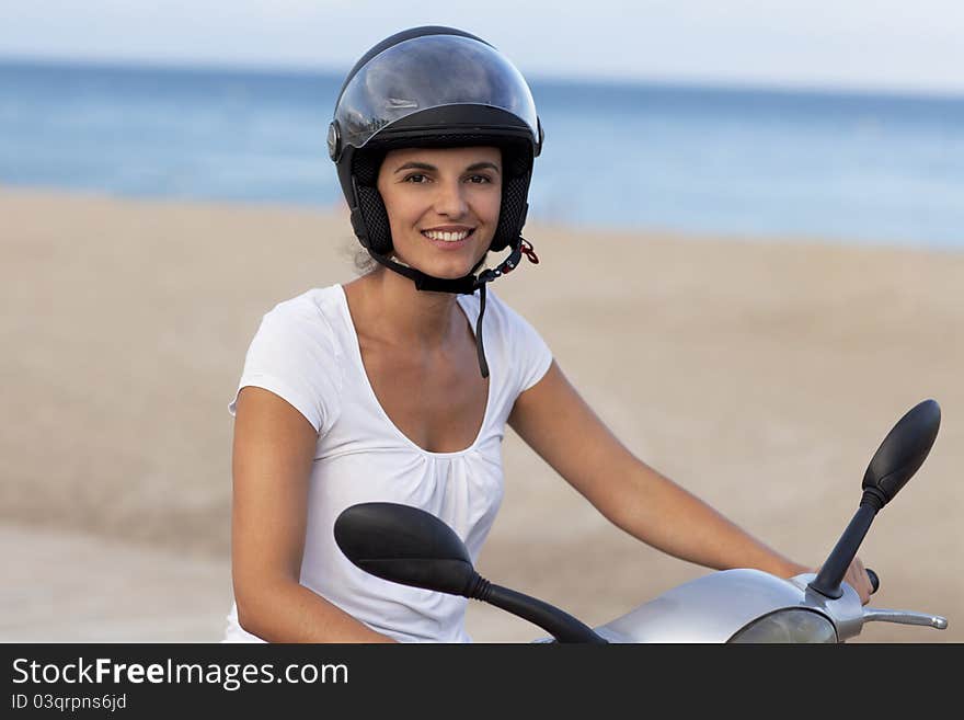 Attractive woman on a scooter