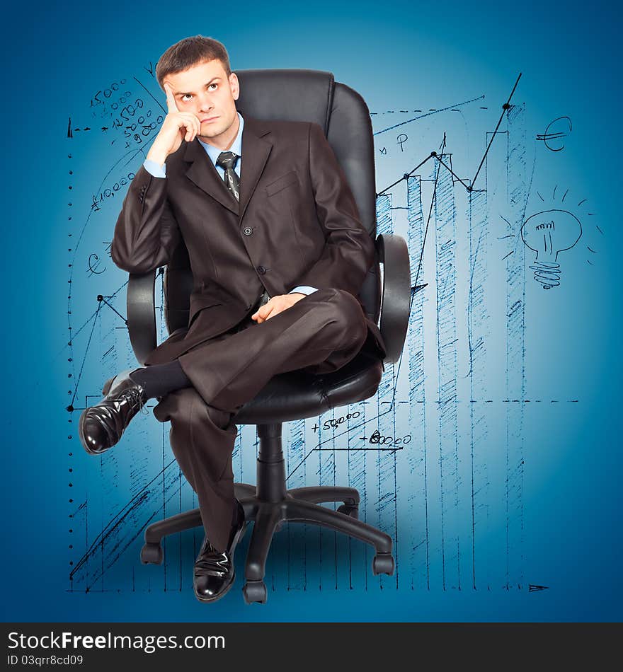 Portrait of young businessman sitting on chair against graph background