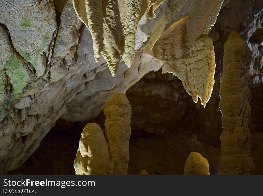 Unusual stalagmites in the underground cavern in france, vertical. Unusual stalagmites in the underground cavern in france, vertical