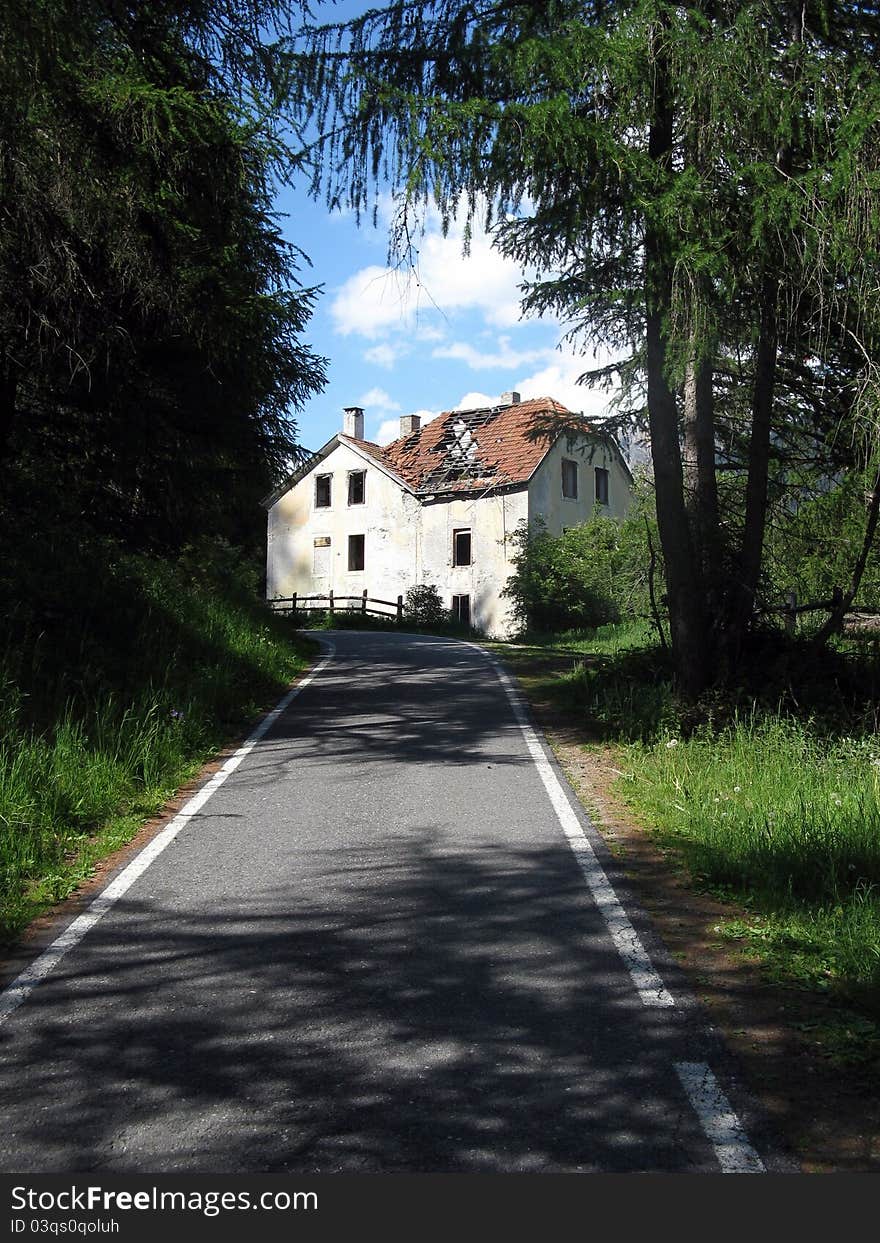 View of a cottage alongside the bicycle path of Val Venosta (a bike way that goes through south Tirol up to the Romantische Strasse in Bayern) just before the Resia lake.