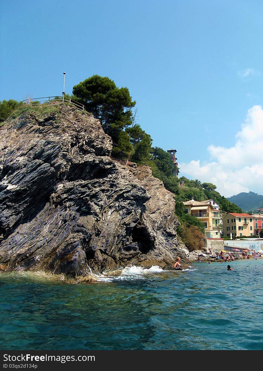 The cliff that closes the bay where the city of Moneglia (liguria, Italy) lies on the north side. This picture has been taken from the sea to show the beauty of the cliff that falls directly into the mediterranean sea