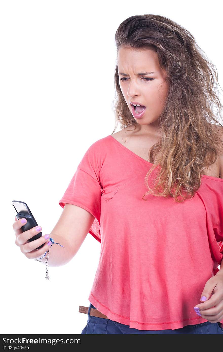 Angry young woman yelling at her phone