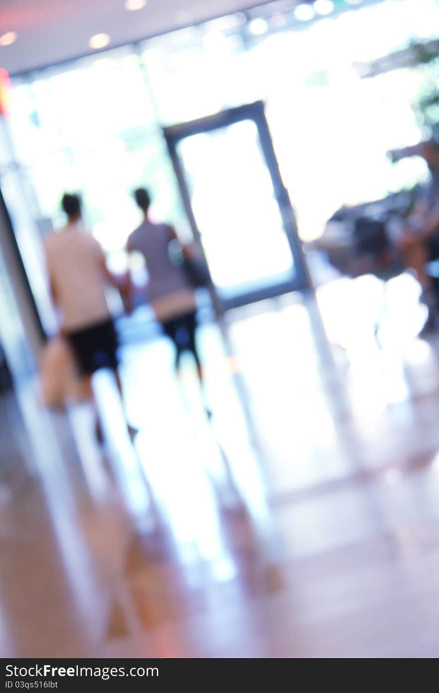 Blurred unrecognizable people in motion in a shopping mall. Blurred unrecognizable people in motion in a shopping mall