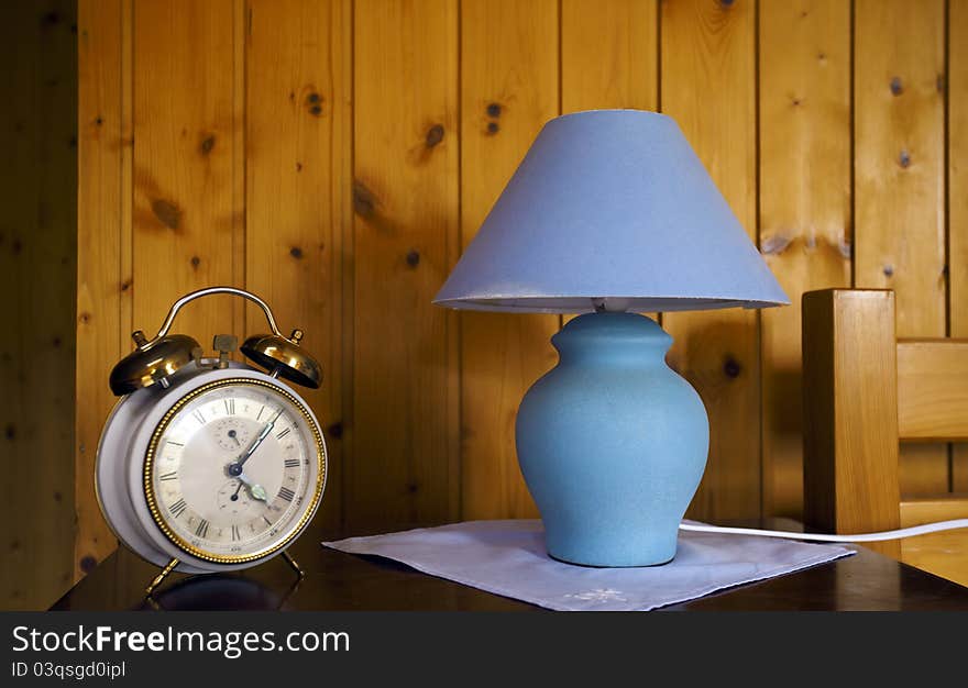 Swiss house decoration with old school clock and lamp. Swiss house decoration with old school clock and lamp