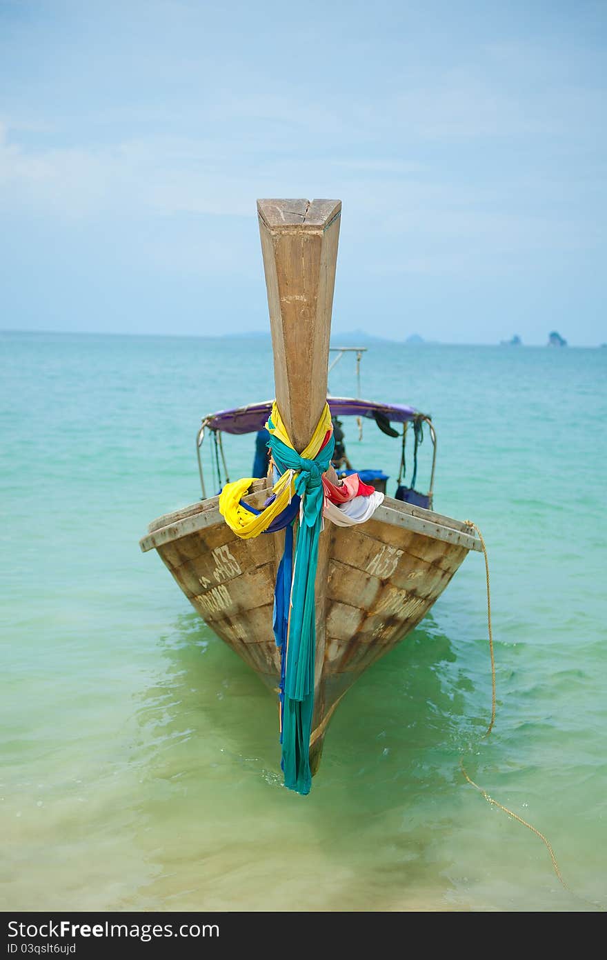 A traditional wooden longtail boat in Krabi, Thailand