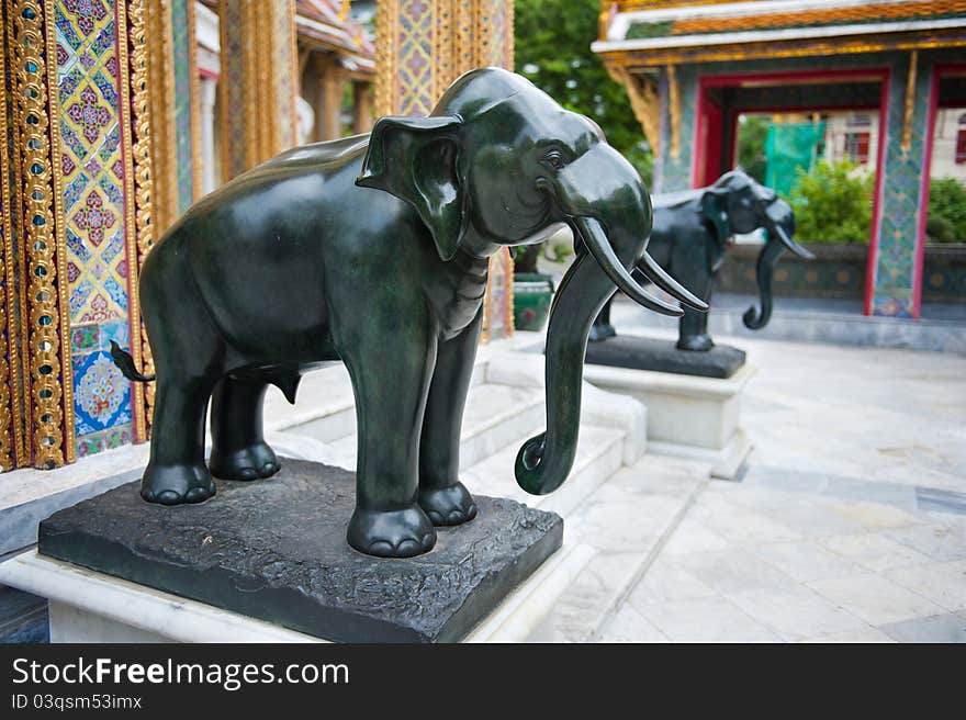 Two elephant statues near the entrance to a Thai temple in Asia