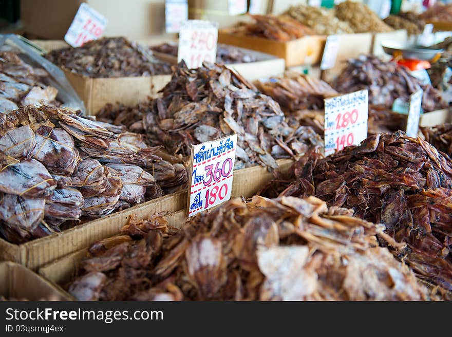 Rows of different kinds of dried seafood for sale at a Thai food market. Rows of different kinds of dried seafood for sale at a Thai food market