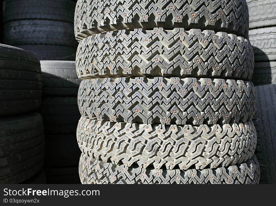 Closeup, detail of spiked tire for rubber recycling. Closeup, detail of spiked tire for rubber recycling