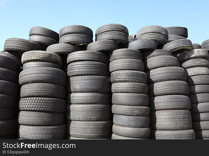 Old car tyres and blue sky