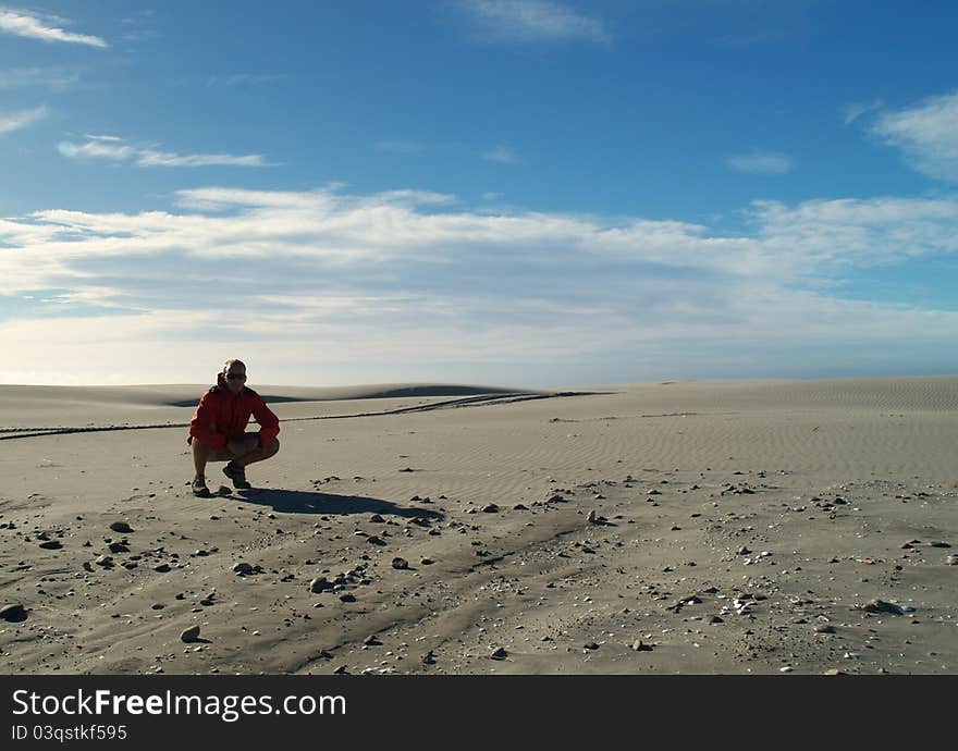 Tramper on the beach, Farewell Spit, South island, New Zealand