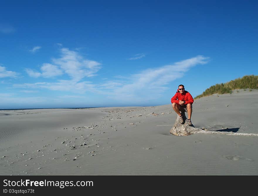 Tramper on the beach, Farewell Spit, South island, New Zealand