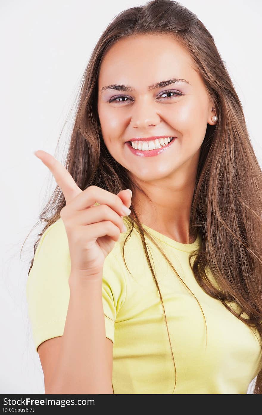 Beautiful young woman pointing