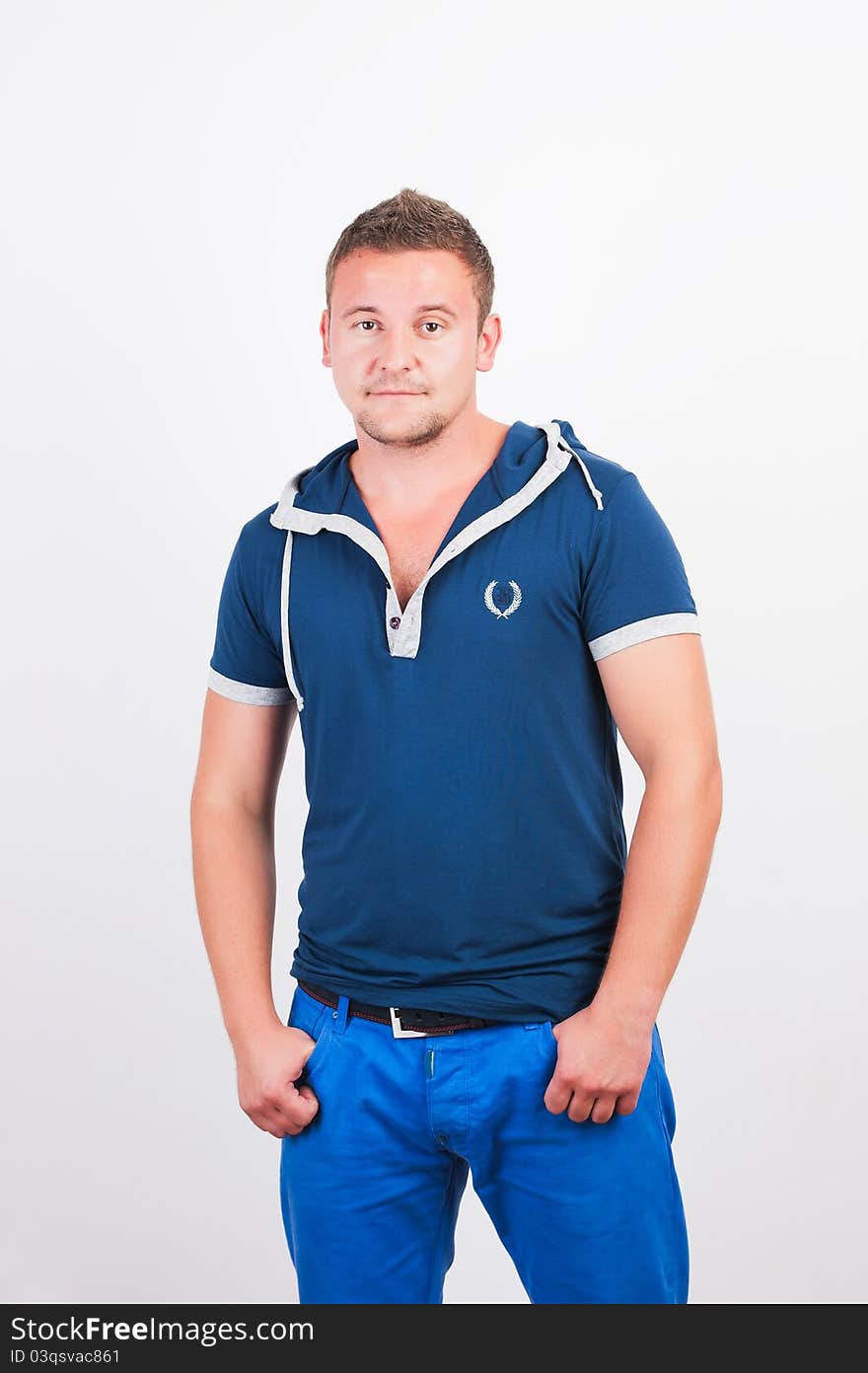 Portrait of happy good looking man smiling over white background