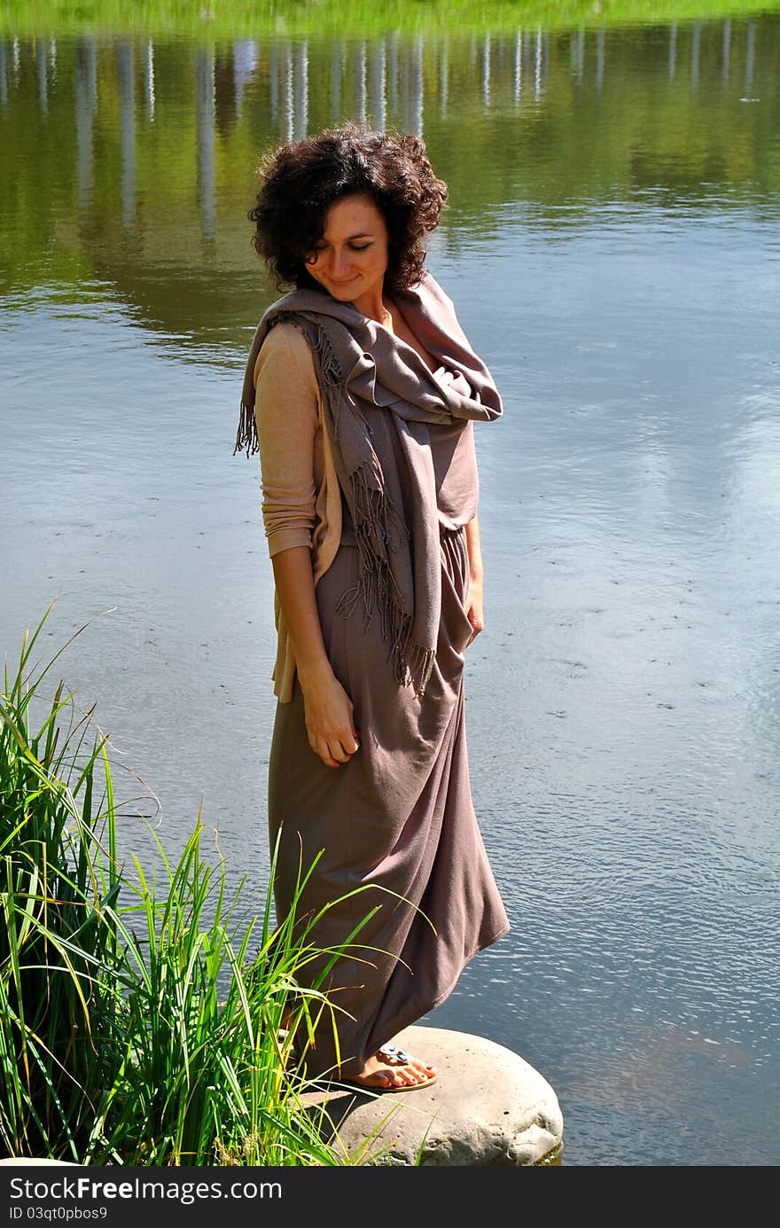 Beautiful woman near the lake