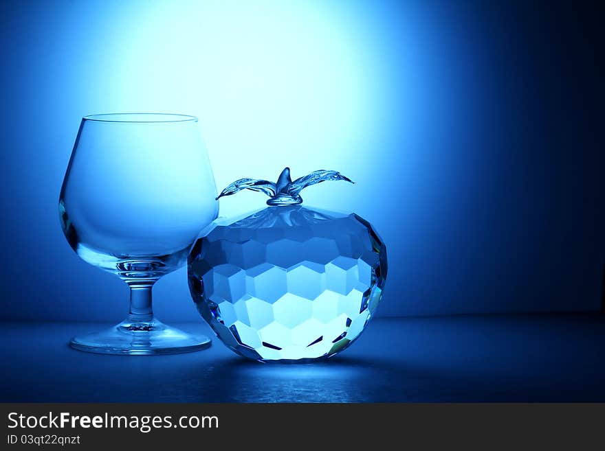 Crystal apple on blue background