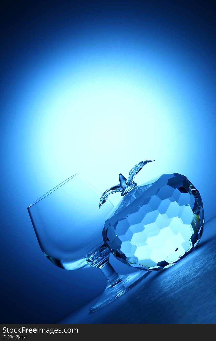 Crystal apple on blue background