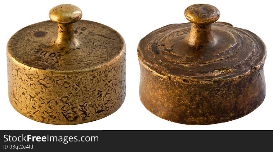 Two old weights. Heavily damaged with a distinct texture.