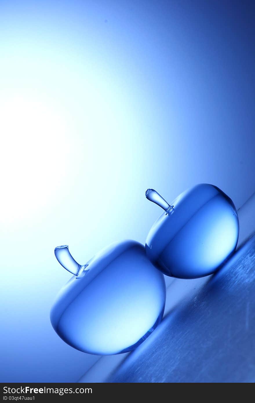 Crystal apple on blue background